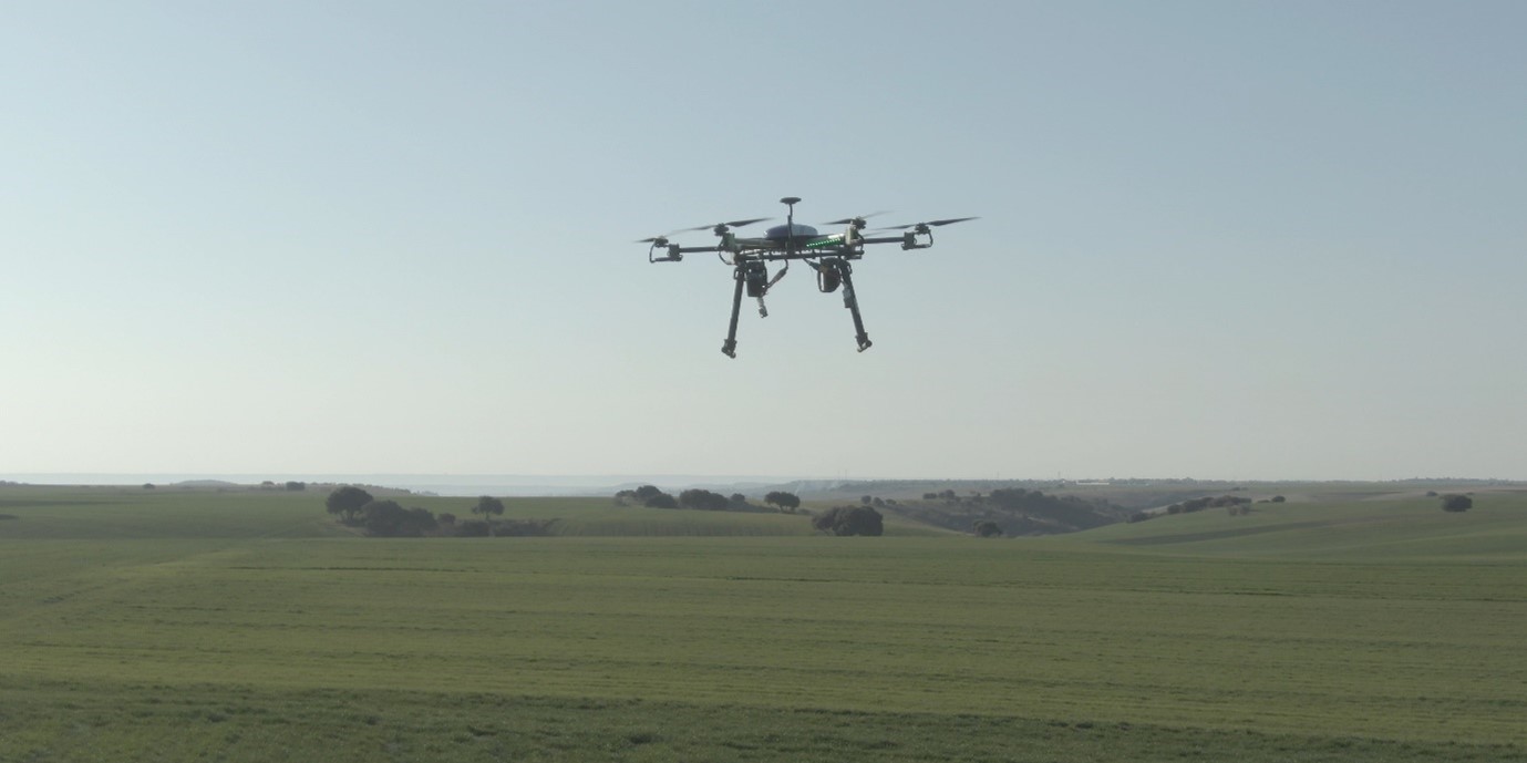 Drone flying on a field