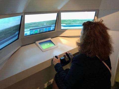 Visitors to the exhibition can try landing a plane in an A350 EGNOS simulator