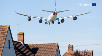 Airplane landing with blue sky background