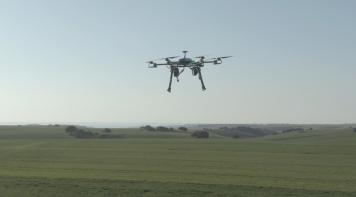 Drone flying on a field