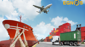 Image image of a port showing a ship, cargo containers and a plane in the middle of the port announcing the EGNOS Open Service 15th Anniversary
